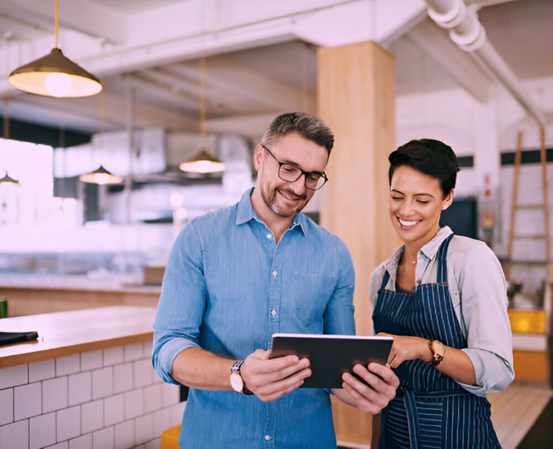 Business owner leading a team in a modern office environment