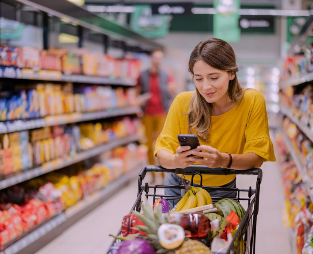 Customer browsing products in a retail aisle with clear navigation