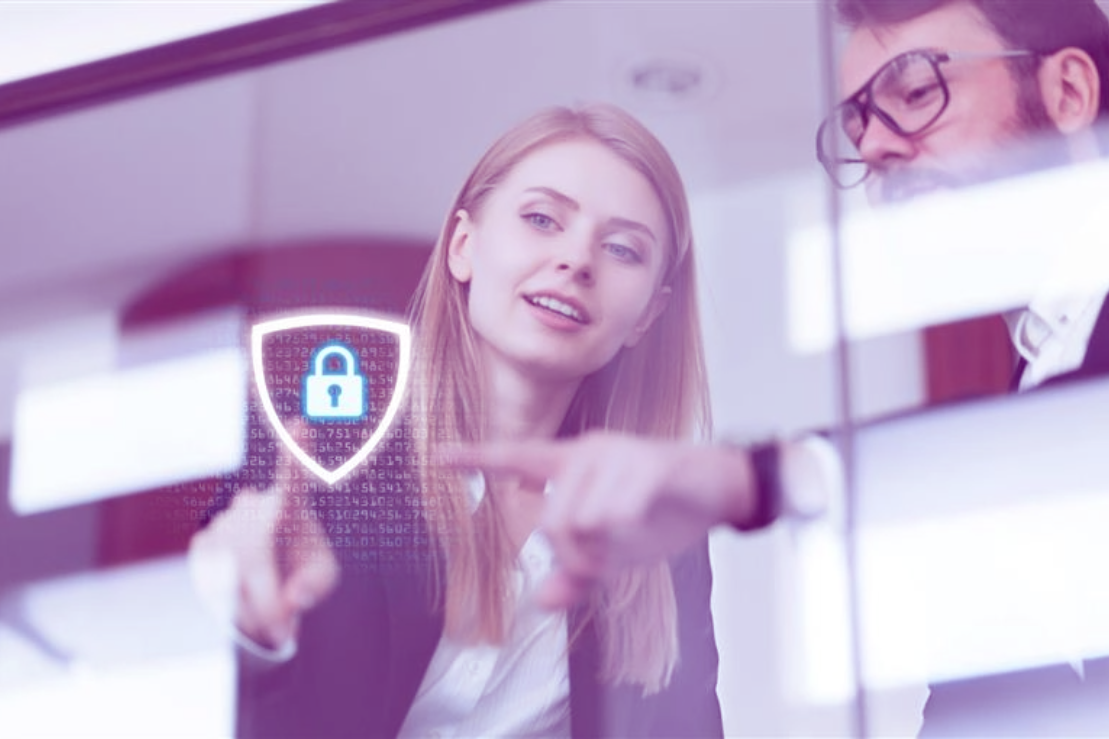 User logging in with secure access controls on a laptop